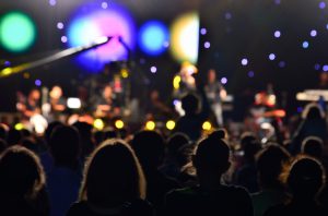 People watching open air concert